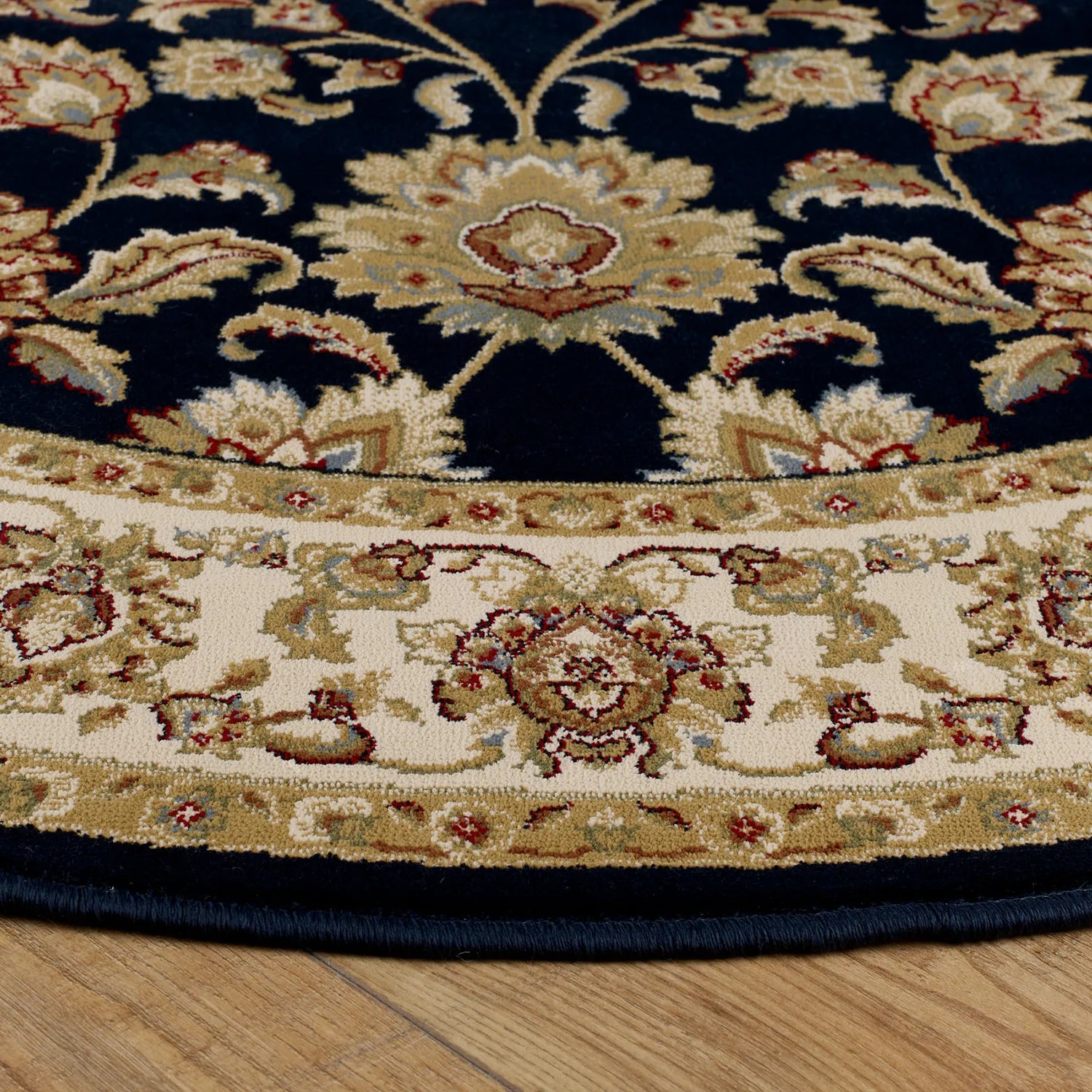 Decorative round rug with intricate patterns on a wooden floor