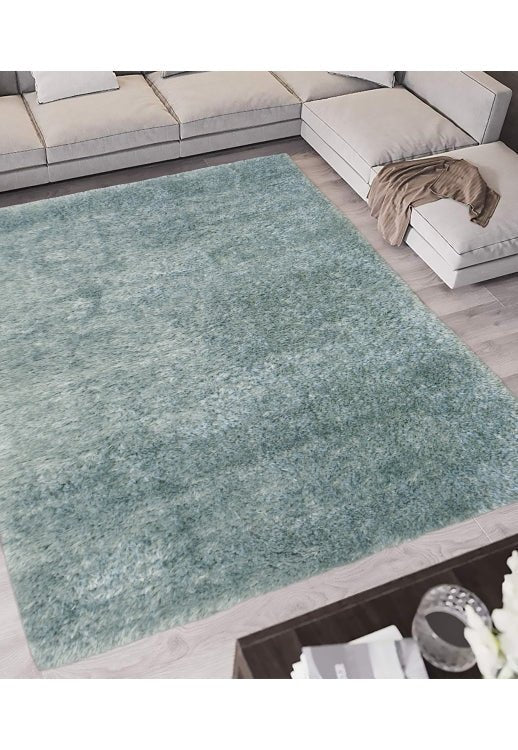 Elegant duck egg blue rug adding softness to living space.