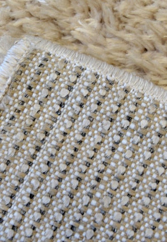 Stylish shaggy rug in light natural tone for modern homes.