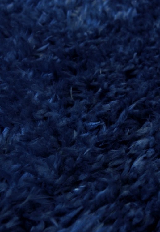 Luxurious shaggy rug in rich navy tone for modern homes.