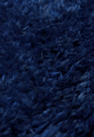 Luxurious shaggy rug in rich navy tone for modern homes.