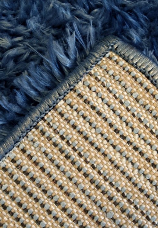 Soft navy rug designed for comfort and bold interiors.