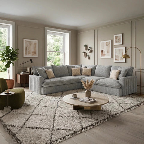 Stylish modern fabric sofa with soft upholstery, deep comfortable seating, plush back cushions, and sleek black feet.