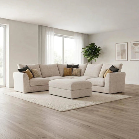 Modern modular fabric sofa with deep cushions, neutral upholstery, and a coordinating stool for added comfort