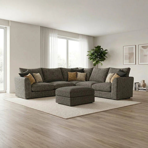 Modern modular fabric sofa with deep cushions, neutral upholstery, and a coordinating stool for added comfort,