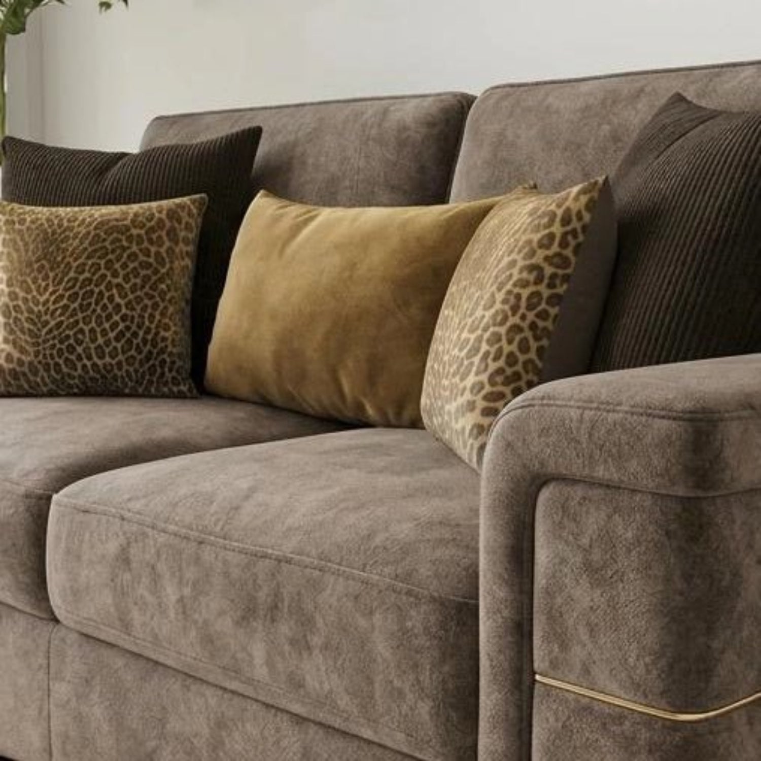 Velvet sofa with plush cushions, soft dappled fabric.