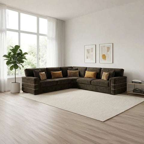 Spacious velvet sofa with deep padded seating, wide armrests, and a stylish modern living room design.