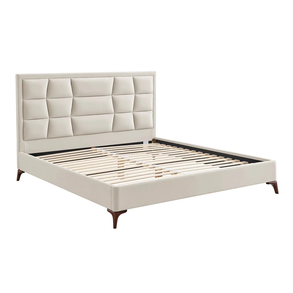 Camila Luxury Bed has a modern platform bed with a velvet upholstered headboard and footboard in a warm cream or off-white fabric, supported by light wood slats and dark brown tapered legs.