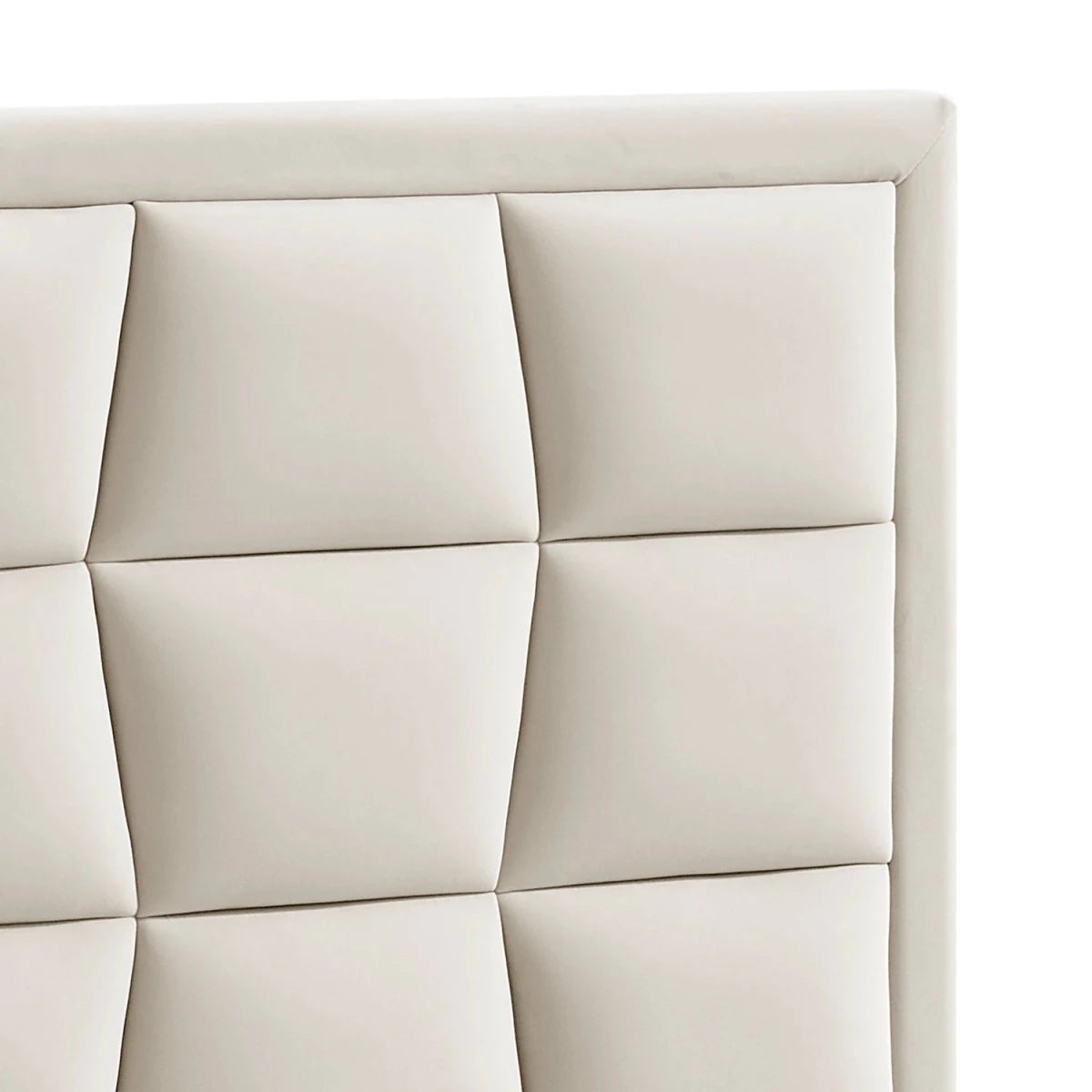 Close-up of the Camila Luxury Beds velvet upholstered headboard with a tufted grid pattern and rounded corners.