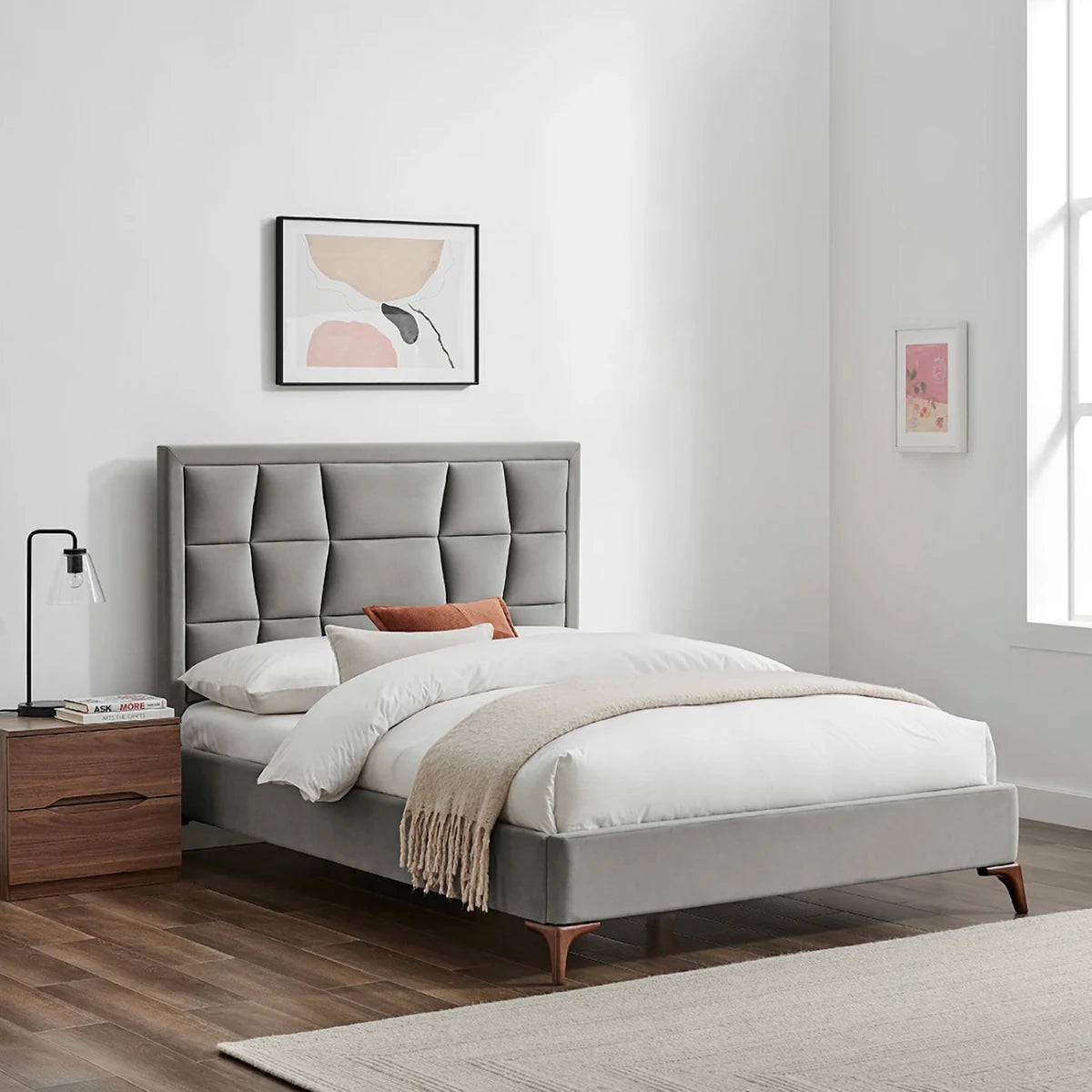 Lifestyle image of the Camila Luxury Bed shown in Silver Grey Velvet. Also available in Natural or Grey in a choice of 3 sizes, Double, Kingsize or Superking.