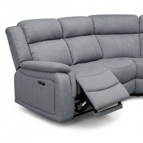 Corner sofa with built-in recliner function for lounging.