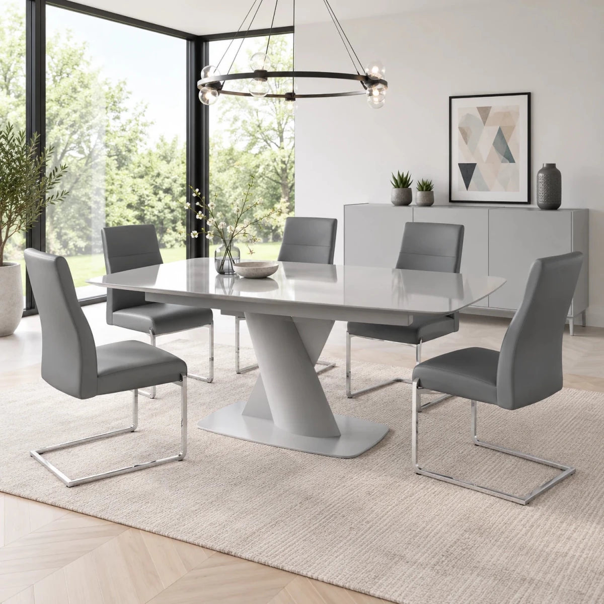 Shop the Lorenzano Light Grey Glass Extending Dining Table with Merlin Grey Faux Leather Chairs. Two table sizes with 4, 6 or 8 chairs.