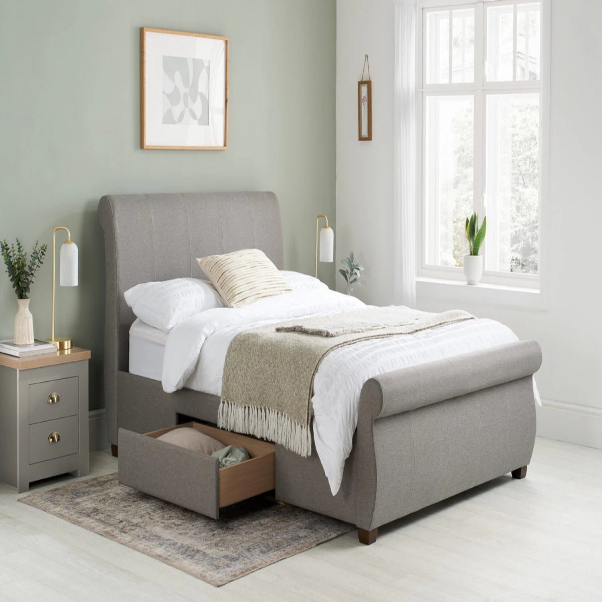 Modern bed frame with integrated storage for bedding and essentials.