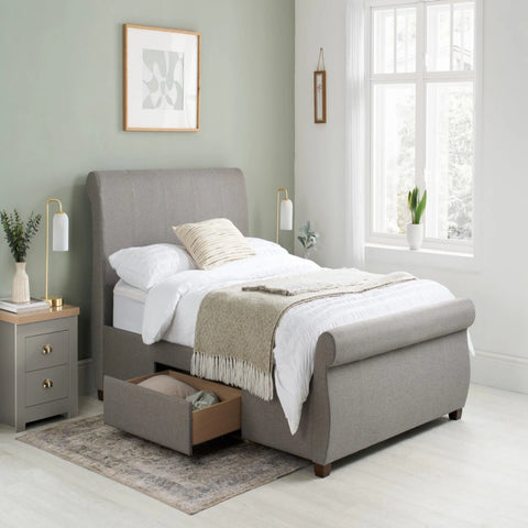 Modern bed frame with integrated storage for bedding and essentials.
