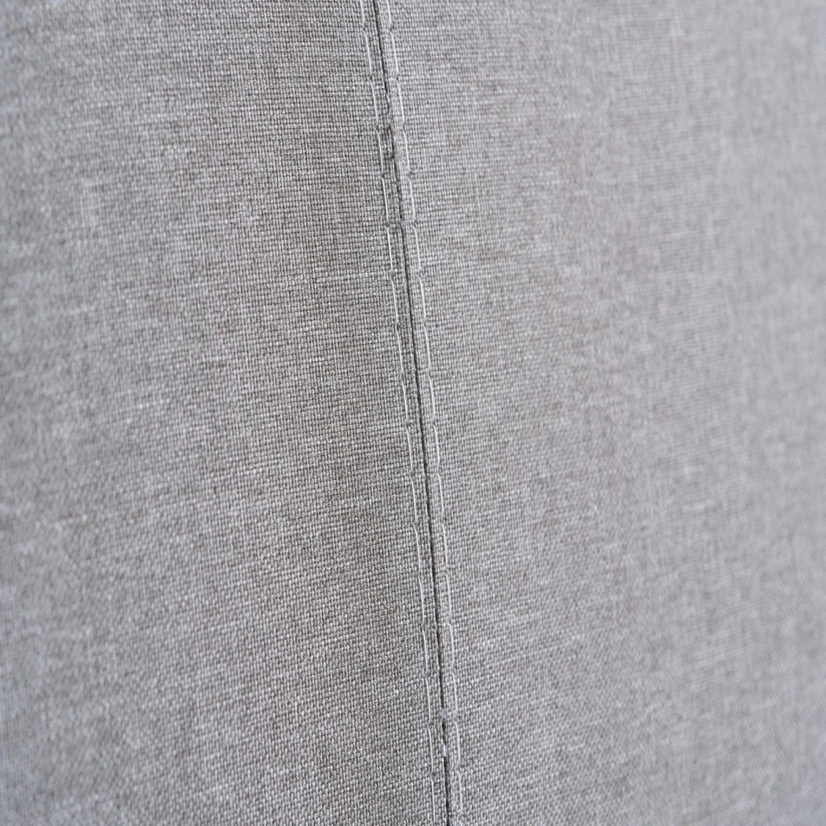 Upholstered fabric surface with comfortable and breathable texture.