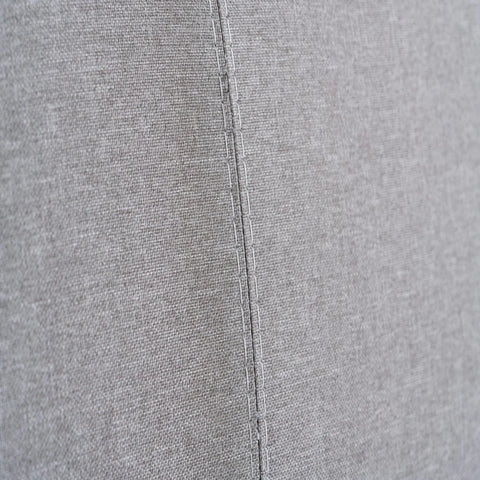 Upholstered fabric surface with comfortable and breathable texture.