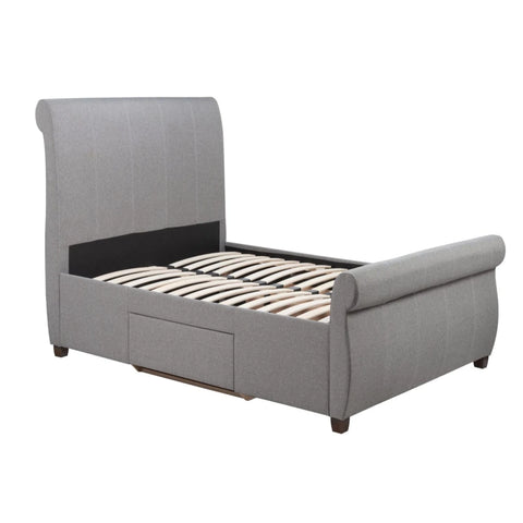Bed frame back view with reinforced structure and curved design.