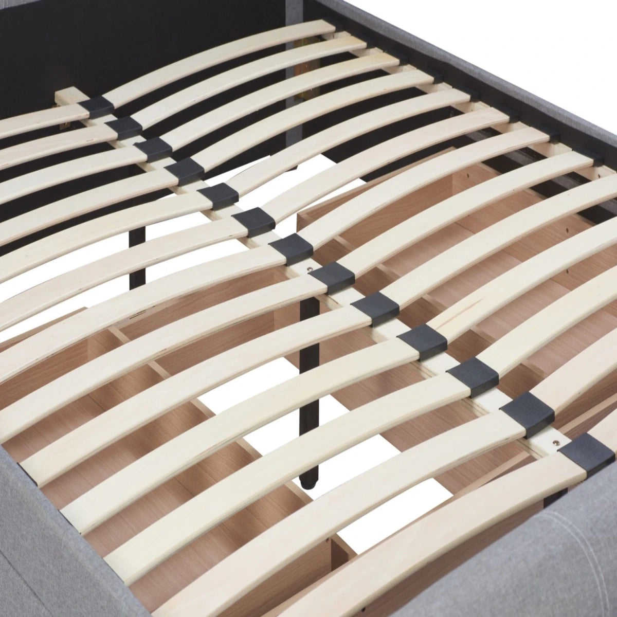 Rear view of sleigh bed showing curved headboard support structure.