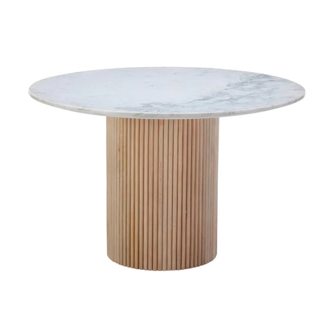 A round dining table featuring a white marble top with subtle gray veining and a fluted light wood pedestal base, shown against a solid white background.