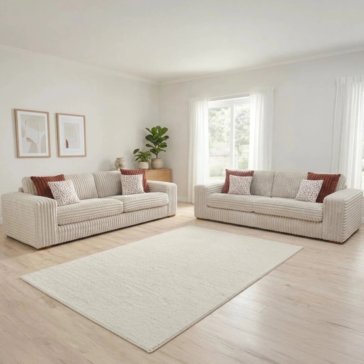 Luton Versailles fabric sofa with cord upholstery, Mahogany and Oak feet, and patterned cushions.