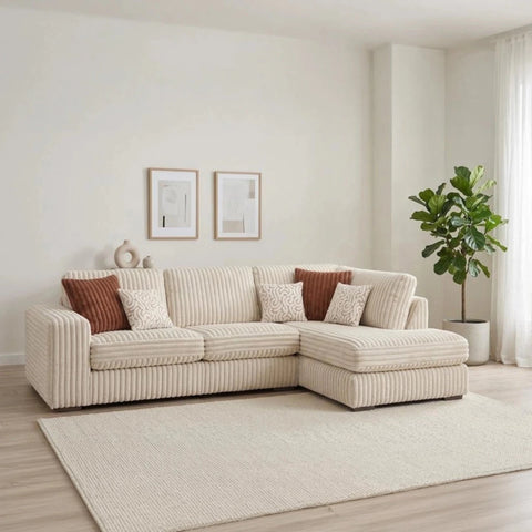 Comfortable chaise lounge with cord fabric, wooden feet, and scatter cushions.