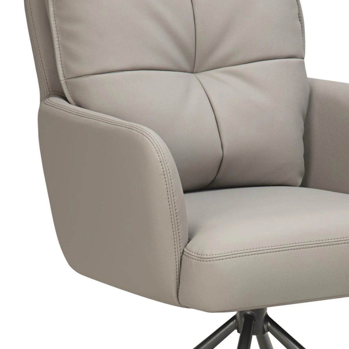 Close-up of a modern Luxe leather effect swivel dining chairs with arms in Latte. Premium deep-padded comfort with a swivel base. 
