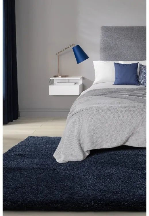 Luxury shaggy blue rug with deep pile and soft plush texture.