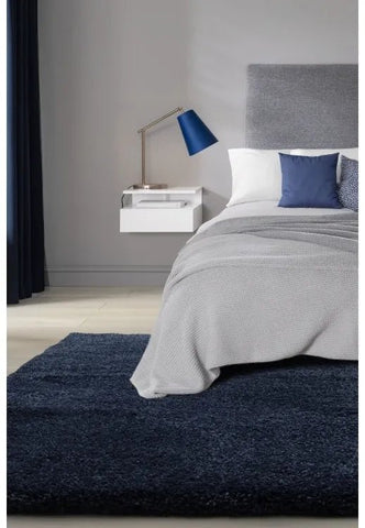 Luxury shaggy blue rug with deep pile and soft plush texture.