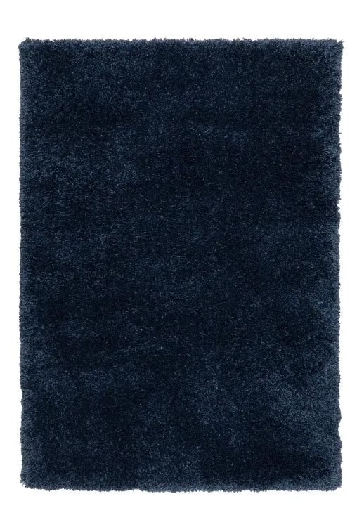 Blue shaggy rug with thick soft fibers and modern design.