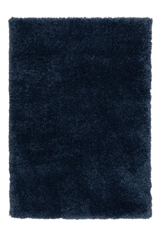 Blue shaggy rug with thick soft fibers and modern design.