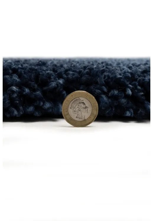 Soft blue shag rug with thick texture and stylish look.