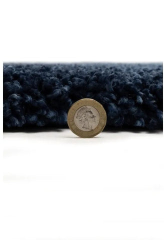 Soft blue shag rug with thick texture and stylish look.