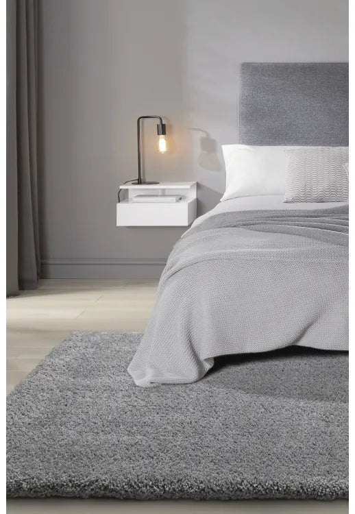 Luxury shaggy grey rug with deep pile and soft plush texture.