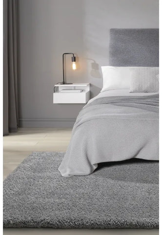 Luxury shaggy grey rug with deep pile and soft plush texture.