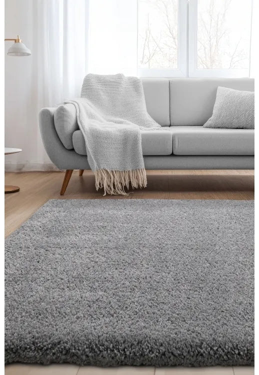 Soft grey shag rug with thick texture and stylish look.