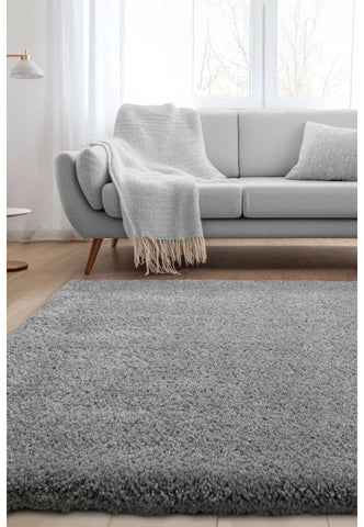 Soft grey shag rug with thick texture and stylish look.