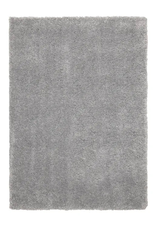 Grey rug texture detail with thick plush strands.
