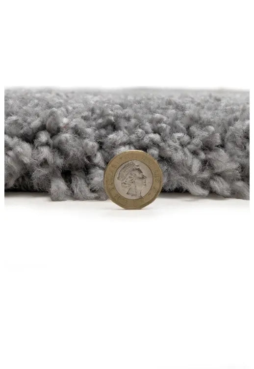 Modern shaggy rug in grey with soft pile and cozy finish.