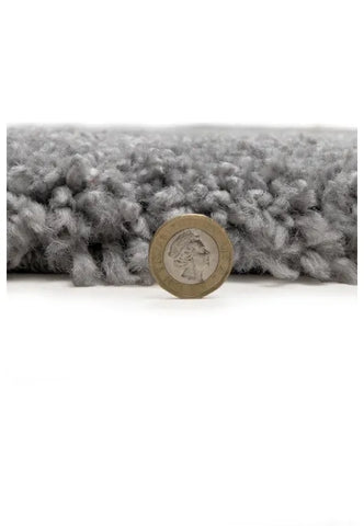 Modern shaggy rug in grey with soft pile and cozy finish.