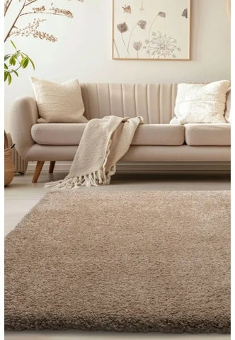 Luxury shaggy natural rug with deep pile and soft plush texture.
