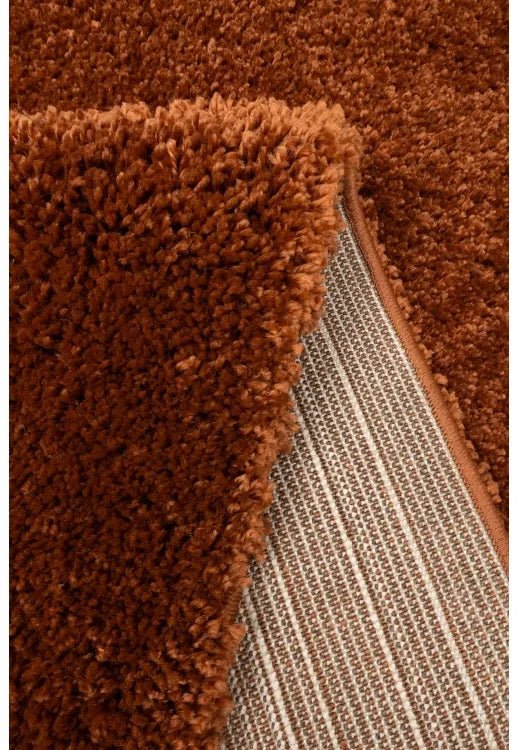 Close-up of soft shaggy fibers with dense terra texture.