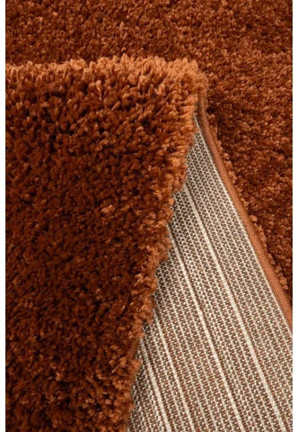Close-up of soft shaggy fibers with dense terra texture.