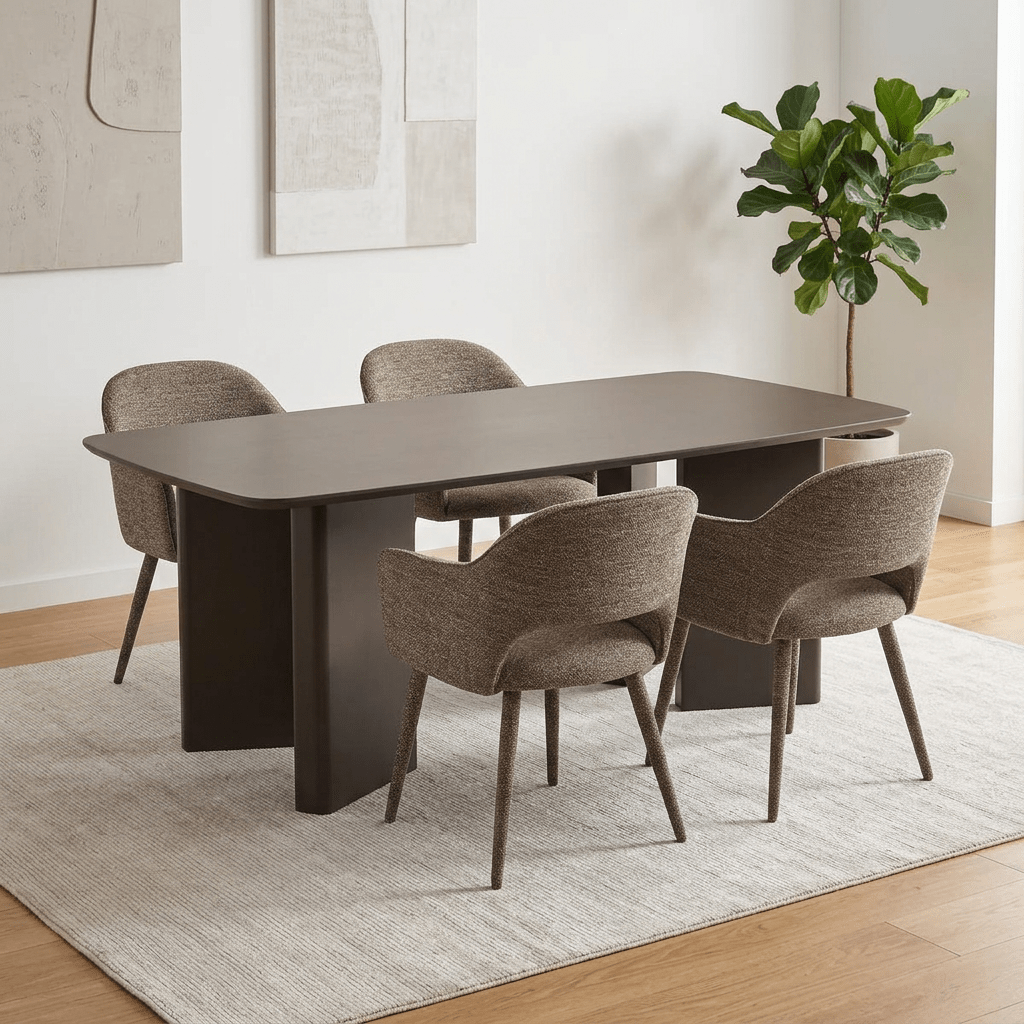 A modern Morocco Matt Chocolate Dining Table with Taupe Fabric Chairs set with a dark brown rectangular table and four upholstered dining chairs in a neutral beige-gray fabric, placed on a light textured rug in a bright dining room.