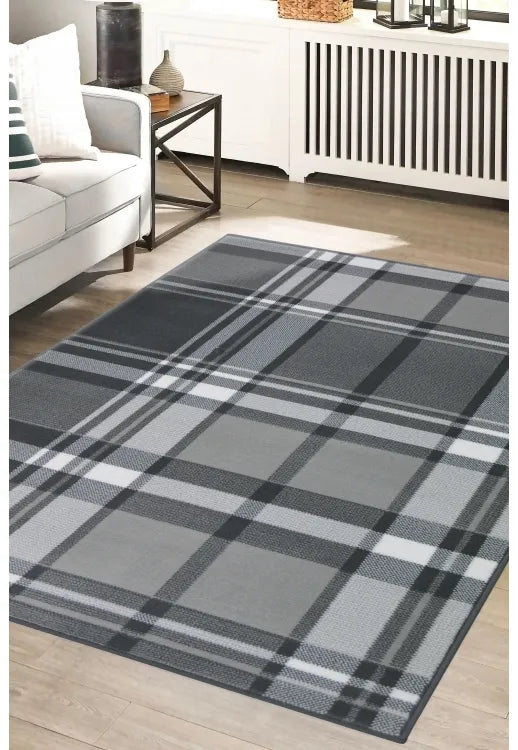 Grey rug with timeless design and subtle pattern.