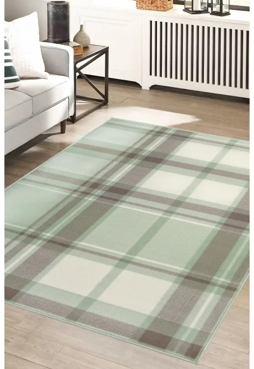 Sage green rug with timeless design and soft natural tones.