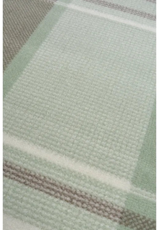 Minimalist rug with soft green tones for modern interiors.