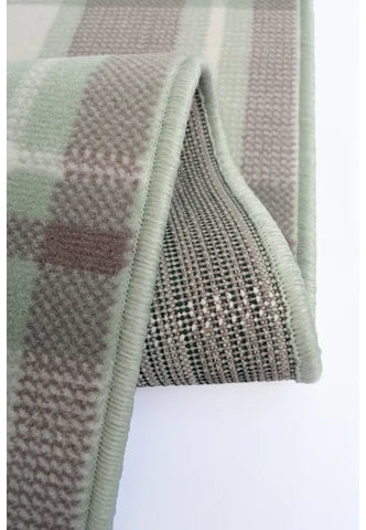 Stylish sage rug adding freshness and warmth to any room.