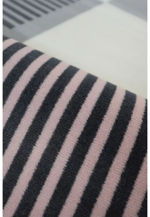 Polypropylene rug with soft pile and durable construction.
