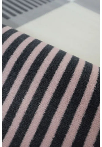 Polypropylene rug with soft pile and durable construction.
