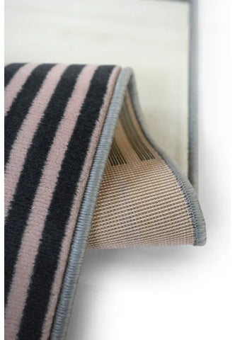 Machine woven rug designed for easy maintenance.